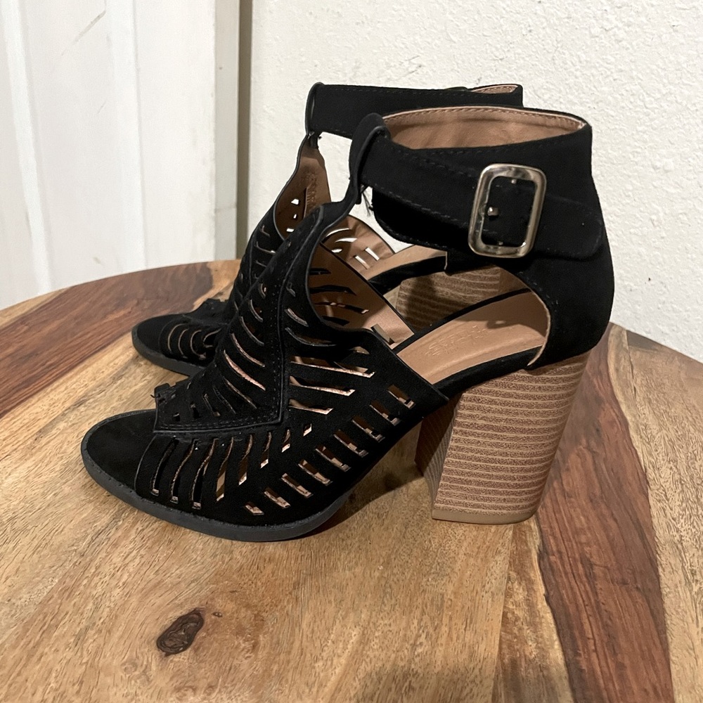 Black suede wooden bootie heels .Size 6.5. Brand new !!!